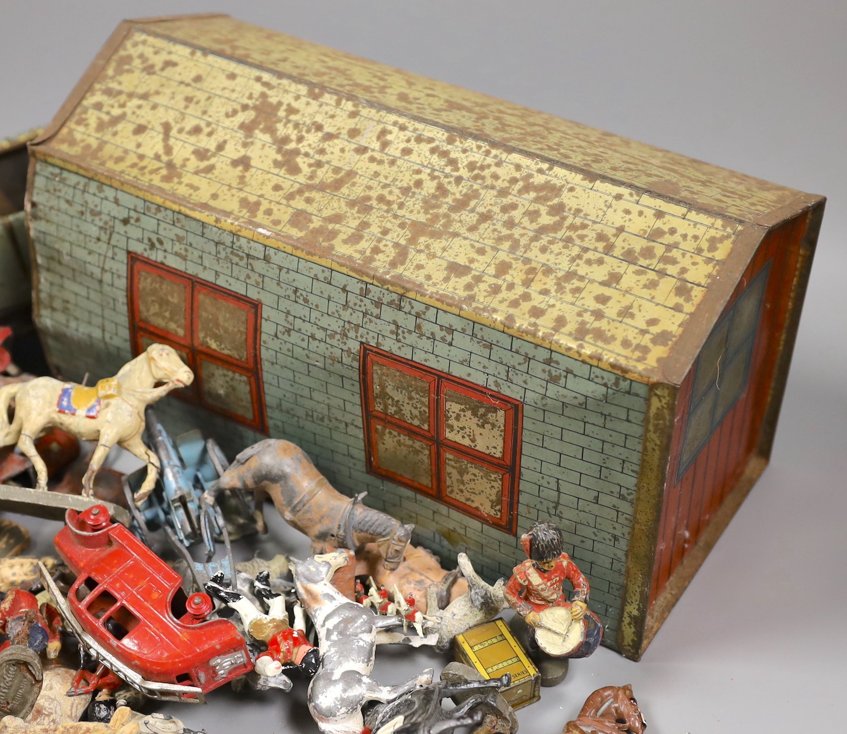 Brenco lithographed tinplate open tourer, and garage, and assorted hollow-cast toys, Elastolic, Dinky Toys, etc.